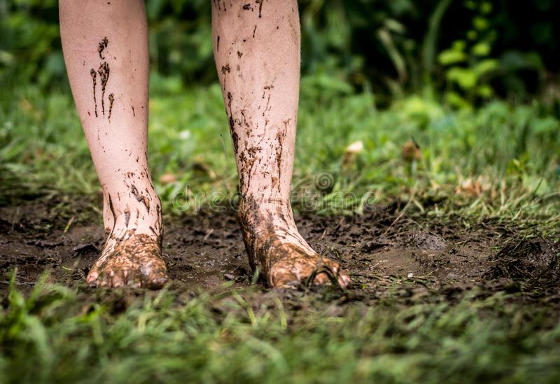 feet-mud-muddy-surrounded-grass-38698983.jpg