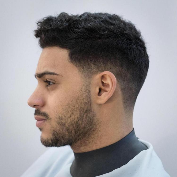 06-a-low-fade-haircut-is-a-stylish-idea-to-rock-naturlaly-curly-hair.jpg