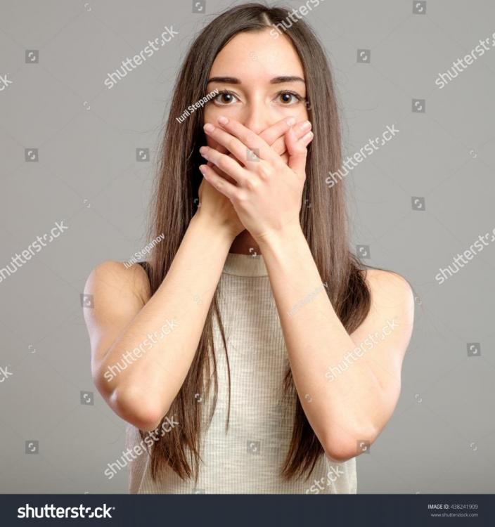 stock-photo-woman-with-hand-cover-her-mouth-isolated-on-gray-background-438241909.jpg