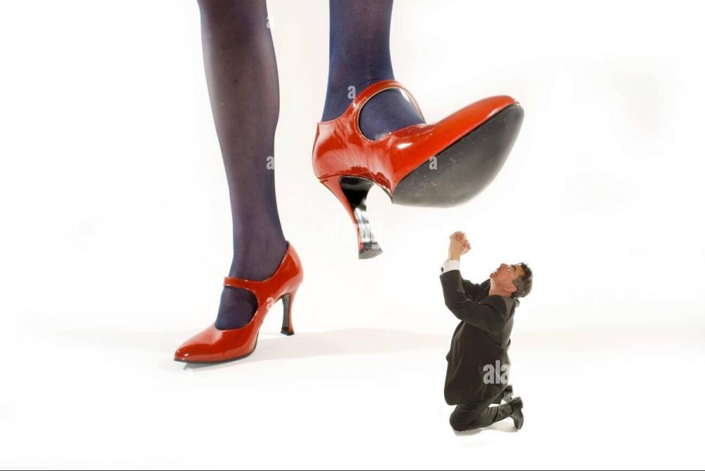 woman-in-red-high-heels-stepping-on-a-shrunken-man-AYRYPM~2.jpg