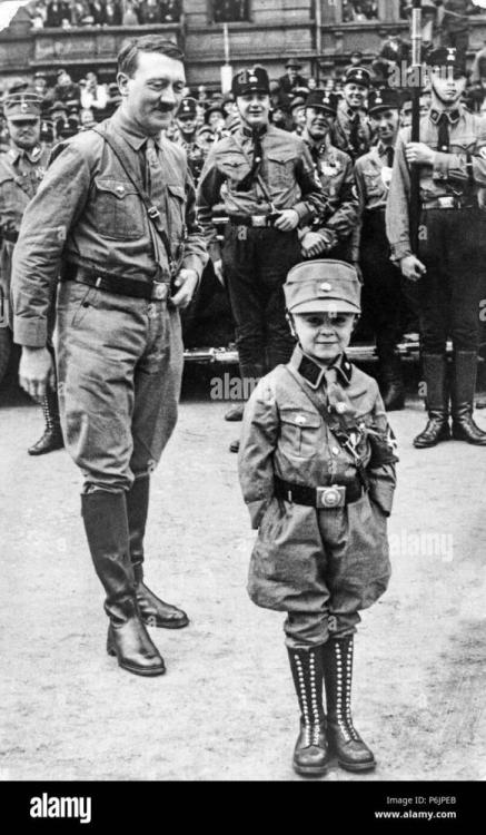 adolf-hitler-smiles-at-a-young-boy-dressed-in-nazi-uniform-during-rally-for-the-nazi-party-P6JPEB.jpg