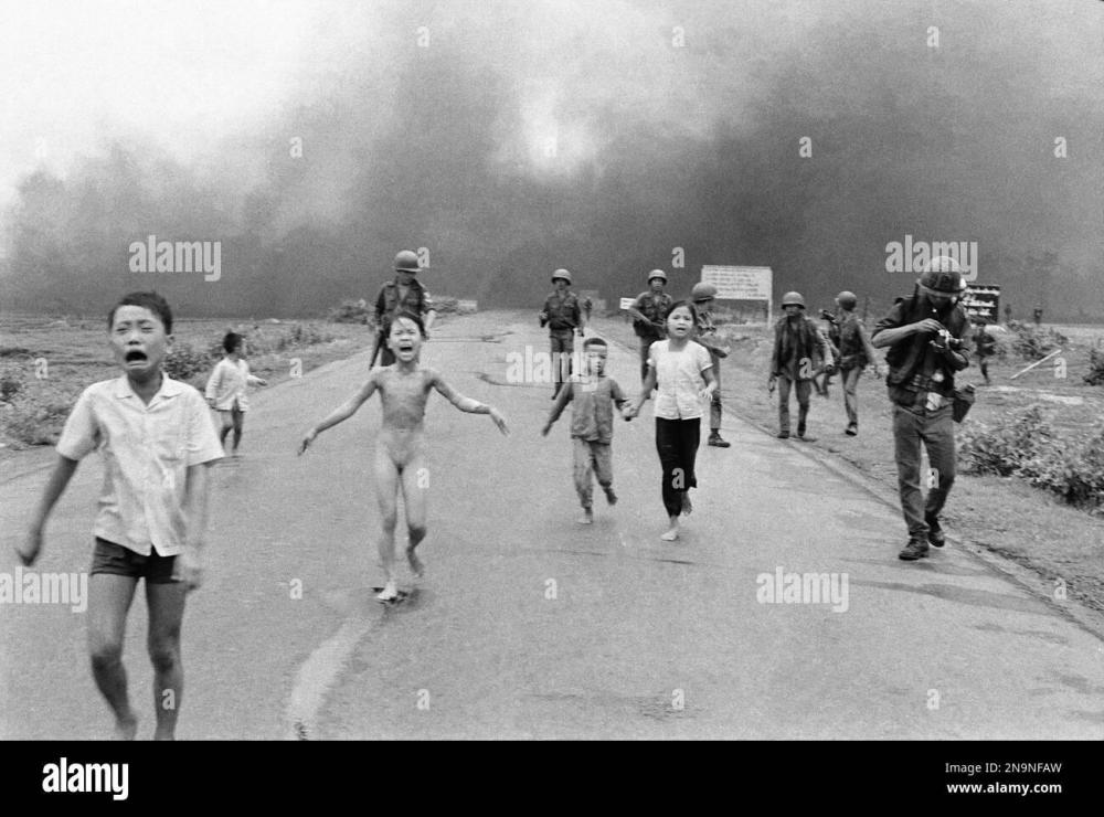 south-vietnamese-forces-follow-after-terrified-children-including-9-year-old-kim-phuc-center-as-they-run-down-route-1-near-trang-bang-after-an-aerial-napalm-attack-on-suspected-viet-cong-hiding-places-june-8-1972-a.jpg